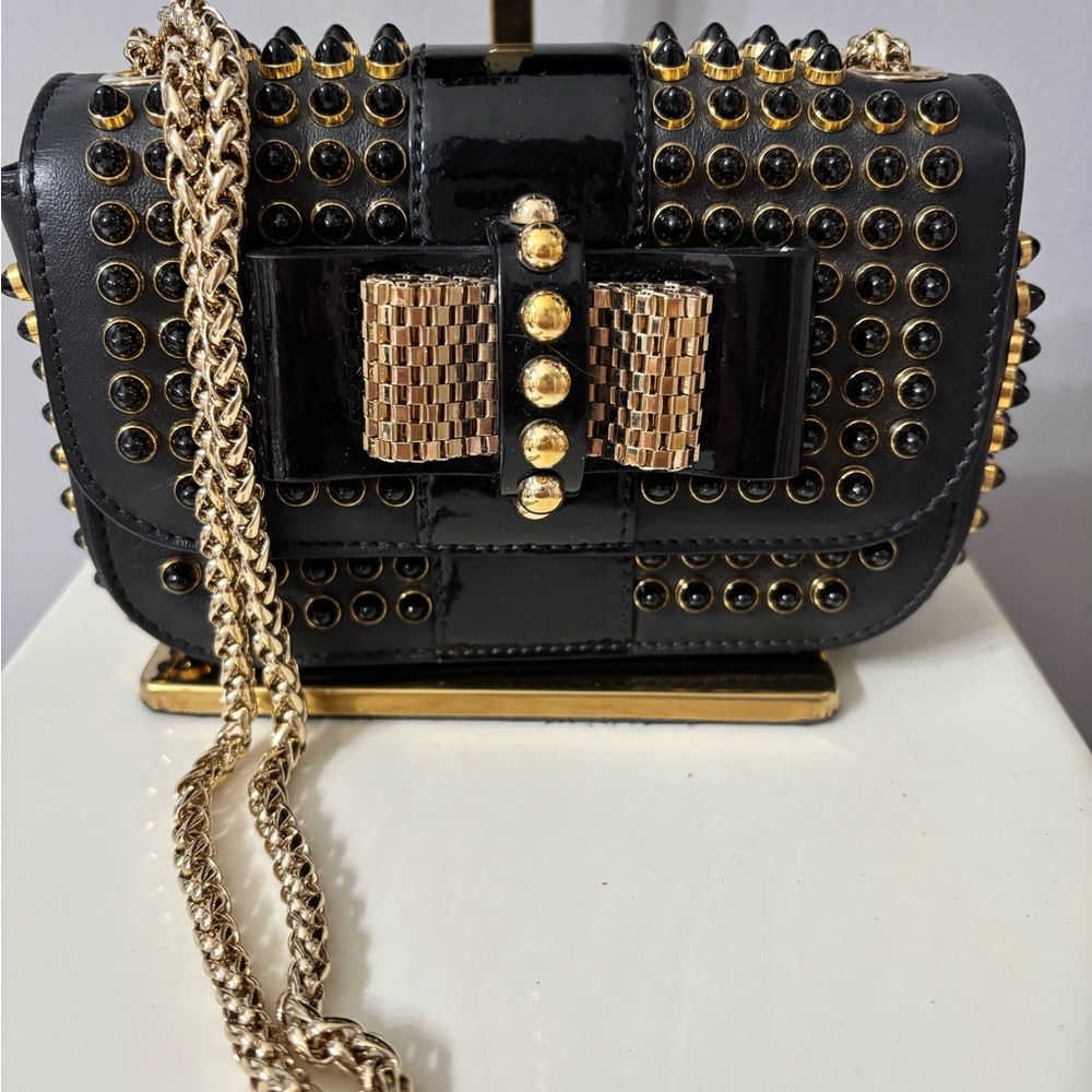 CHRISTIAN LOUBOUTIN
Black Leather And Black/Gold Spike Mini Sweet Charity Bag